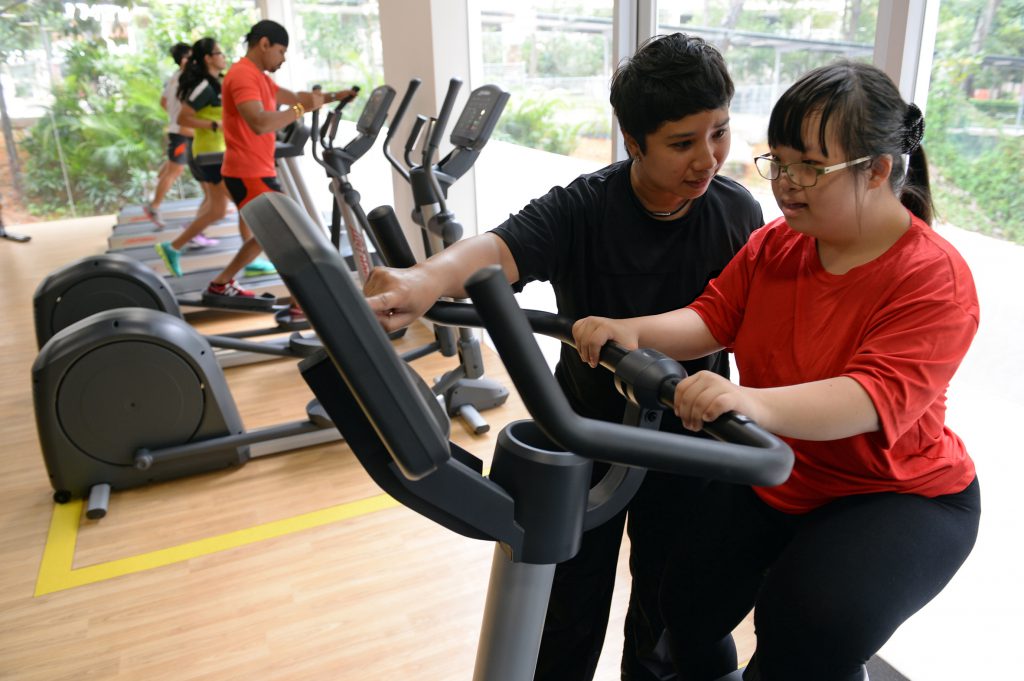 Participants using exercise bikes in the fitness center